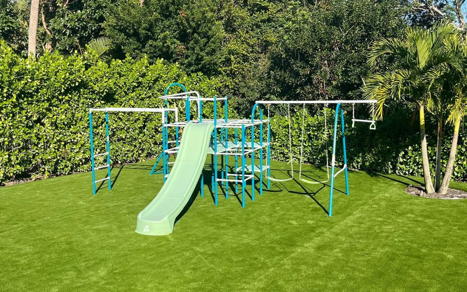 Finished artificial turf around a children's play structure