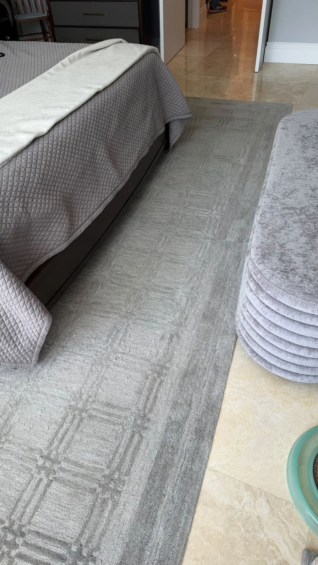 Clean carpet beside a bed after professional extraction in Fort Lauderdale