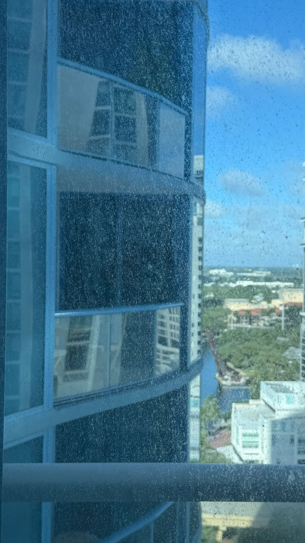 Window glass before professional cleaning at a Las Olas residence