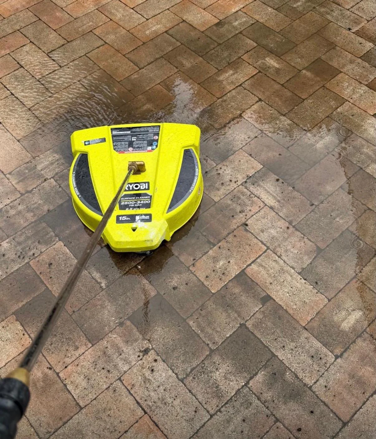 Close view of a circular surface cleaner ready for paver work