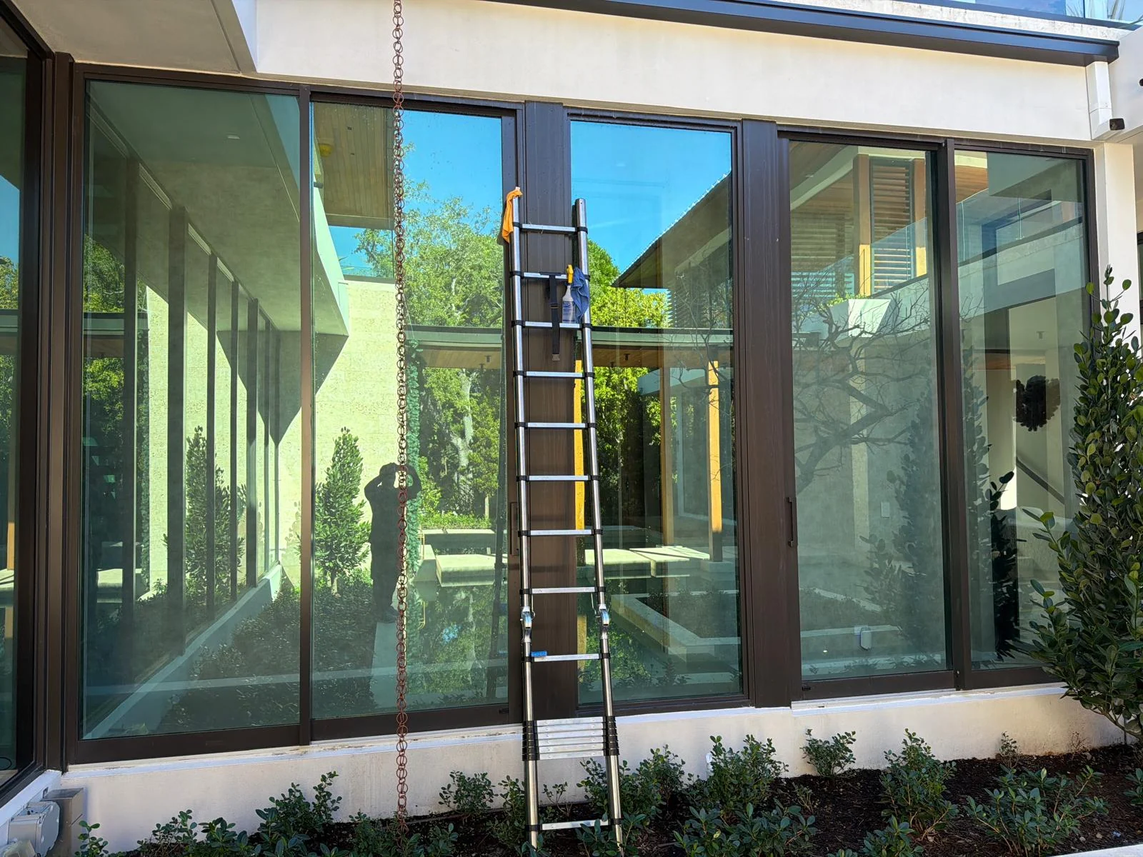 Fibratto ladder access at a residential window during cleaning